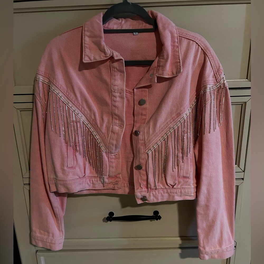 Pink denim jacket with fringe